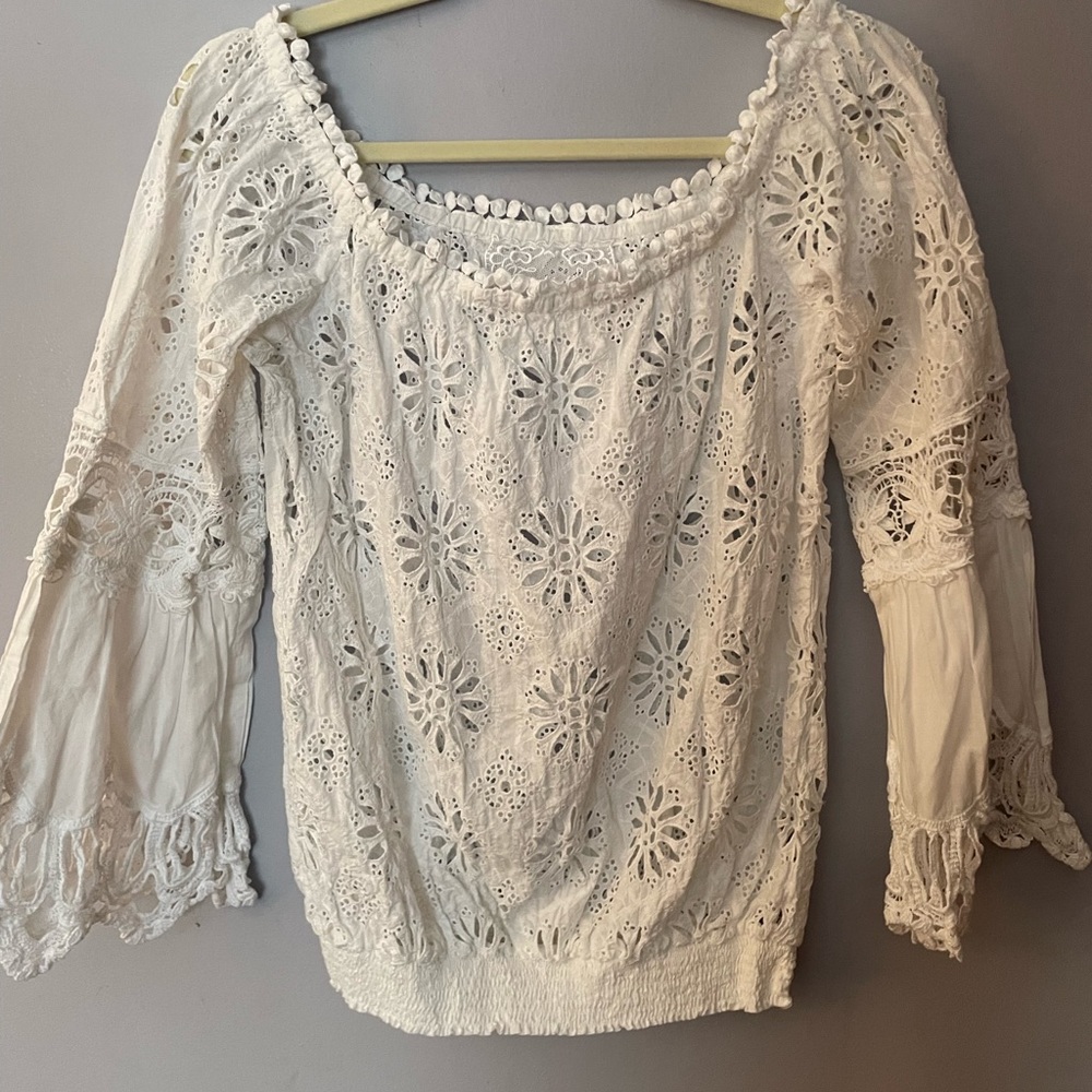 Temptation Positano blouse. Says large but best for size small.